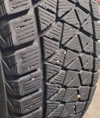 
								225 70 16, Bridgestone winter tires, 80% tread remaining full									
