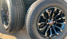 New 1995-2024 GMC Sierra AT4x black rims N Firestone Winter tire
